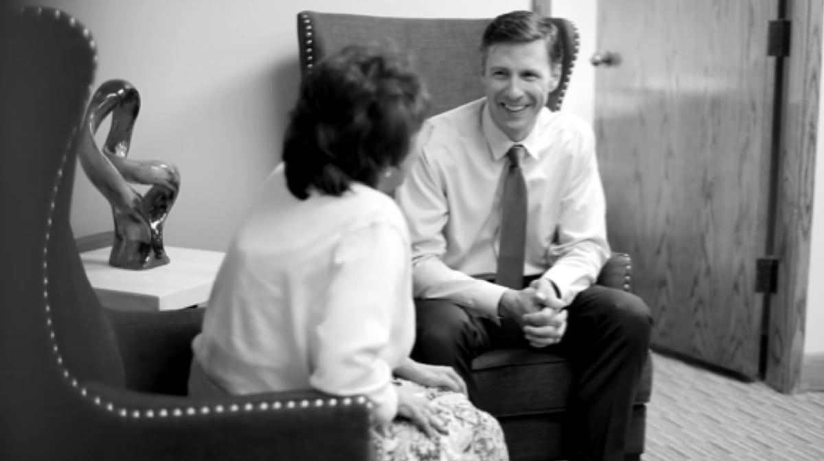 Bill talking to client